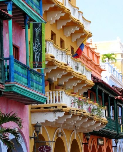 Colorful colonial balconies with Colombian flag in Cartagena old town